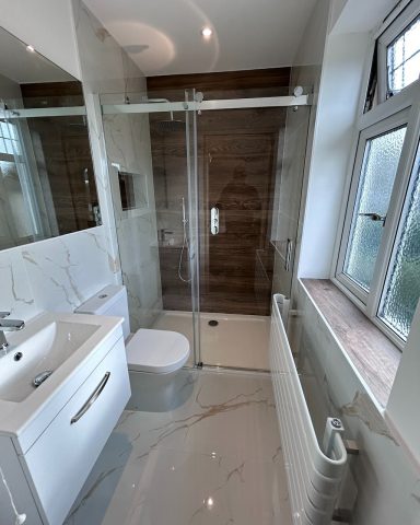 En-suite shower in Sutton Modern bathroom with a walk-in shower installation in Sutton by Tom's Services